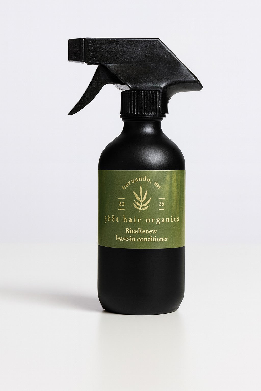 5681 Hair Collection RiceRenew organic leave-in conditioner spray in a matte black bottle with a green label